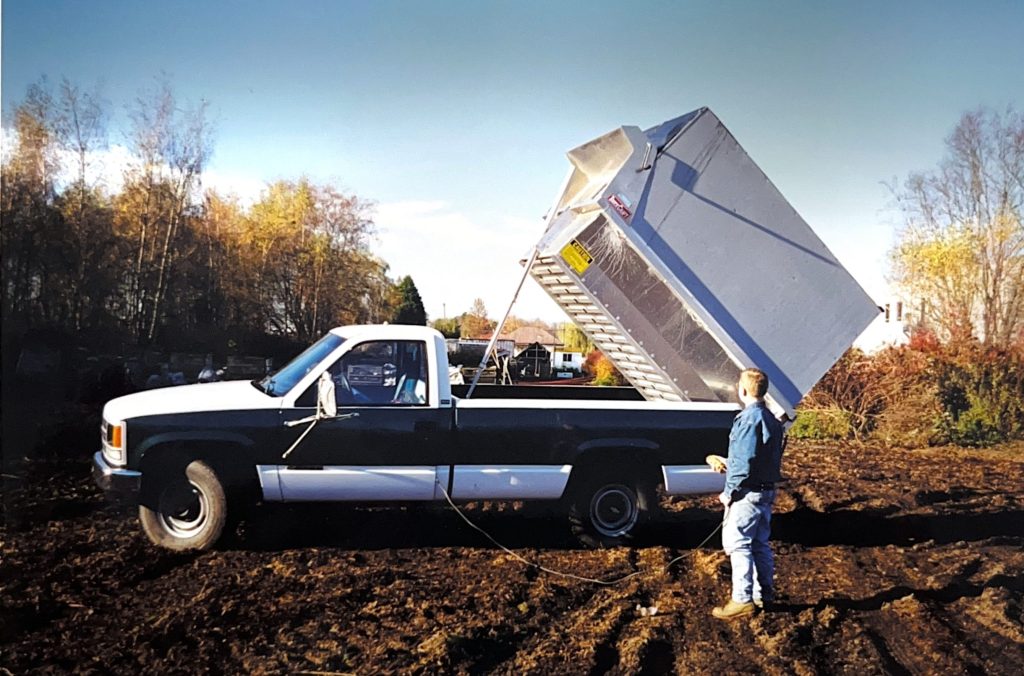 Historical photo of Premier Landscaping's first leaf vacuum equipment.