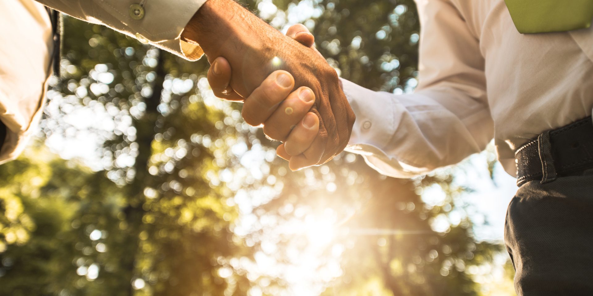 Outdoor handshake image for commercial landscaping company blog by Greater Vancouver and Fraser Valley commercial landscaping and hardscaping specialists Premier Landscaping