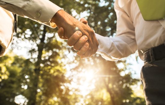 Outdoor handshake image for commercial landscaping company blog by Greater Vancouver and Fraser Valley commercial landscaping and hardscaping specialists Premier Landscaping